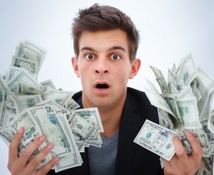 Surprised man holding money