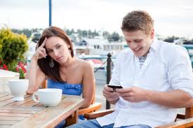 Couple distracted by phone
