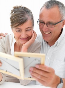 Mature romantic couple looking at photos